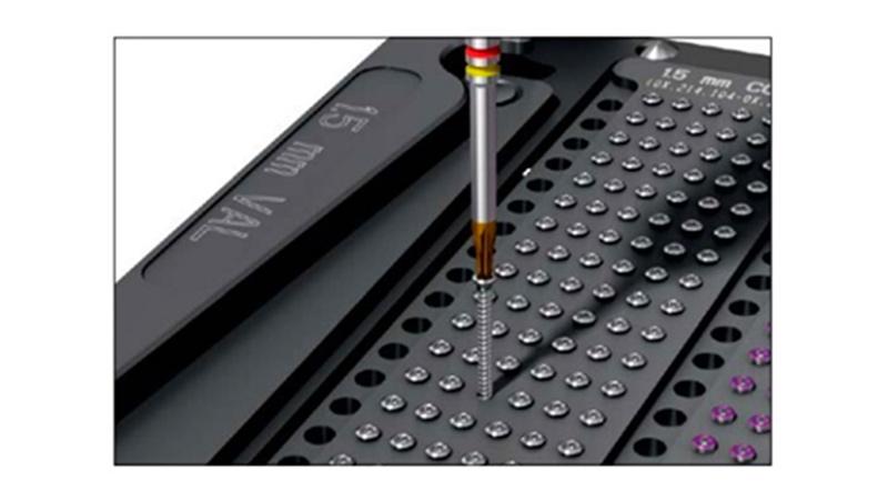 Variable Angle Locking Hand System screw removed from implant module in straight vertical position